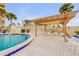 Community pool featuring a covered lounge area, perfect for relaxation and entertaining at 3606 S Peninsula Dr # 509, Port Orange, FL 32127