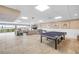 Light and airy recreation room with ping pong table, seating, and water views at 3606 S Peninsula Dr # 509, Port Orange, FL 32127