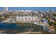 Aerial view showcasing the condominium and the neighborhood with a waterfront view at 3606 S Peninsula Dr # 703, Port Orange, FL 32127