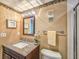 Bathroom featuring granite counters, decorative lighting and framed starfish art at 3606 S Peninsula Dr # 703, Port Orange, FL 32127