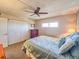 Comfortable carpeted bedroom with ceiling fan and ample closet space at 3606 S Peninsula Dr # 703, Port Orange, FL 32127