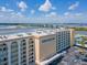 Aerial view of the Admiralty Club condo building, revealing waterfront views and ample parking at 3606 S Peninsula Dr # 703, Port Orange, FL 32127