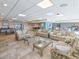 Large common game room and lounge with multiple seating areas and games, including waterfront views at 3606 S Peninsula Dr # 703, Port Orange, FL 32127