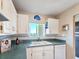 Functional kitchen with a view, equipped with essential appliances and ample counter space at 3606 S Peninsula Dr # 703, Port Orange, FL 32127