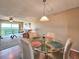 Bright living room and dining area offer balcony access with ocean views at 3606 S Peninsula Dr # 703, Port Orange, FL 32127