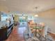 Living room and dining area with ceiling fan and slider to balcony at 3606 S Peninsula Dr # 703, Port Orange, FL 32127