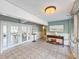 Common lobby with tiled floors and a hallway leading to rooms overlooking the water at 3606 S Peninsula Dr # 703, Port Orange, FL 32127