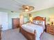 Well-lit main bedroom boasts a ceiling fan and ample closet space at 3606 S Peninsula Dr # 703, Port Orange, FL 32127
