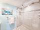 The glass enclosed shower features a tiled surround and niche at 3606 S Peninsula Dr # 703, Port Orange, FL 32127