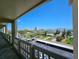 Balcony view of the city skyline showing palm trees and distant buildings at 3606 S Peninsula Dr # 703, Port Orange, FL 32127