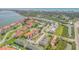 Expansive aerial shot showcases a waterfront residential community with multiple buildings and lush landscaping at 402 Bouchelle Dr # 206, New Smyrna Beach, FL 32169