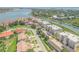 Aerial view showcases a peaceful neighborhood with tree-lined streets, and waterfront access at 402 Bouchelle Dr # 206, New Smyrna Beach, FL 32169