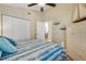 Well-lit bedroom with closet and a peep into the dining and living area at 402 Bouchelle Dr # 206, New Smyrna Beach, FL 32169