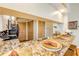 Kitchen counter with a granite countertop, appliances, and seating at 402 Bouchelle Dr # 206, New Smyrna Beach, FL 32169