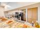 Kitchen counter with a granite countertop, open to the living area, and wood folding closet doors at 402 Bouchelle Dr # 206, New Smyrna Beach, FL 32169