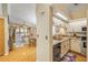 Bright kitchen with stainless steel appliances and a granite countertop open to the living space at 402 Bouchelle Dr # 206, New Smyrna Beach, FL 32169