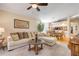 Open-concept layout with a spacious living room, dining area, and kitchen with counter seating at 402 Bouchelle Dr # 206, New Smyrna Beach, FL 32169