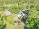 Charming property featuring a home, barn, lush greenery, and ample parking at 416 Western Rd, New Smyrna Beach, FL 32168