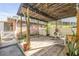 Covered backyard patio, offering shade, seating, and space for relaxation outdoors at 416 Western Rd, New Smyrna Beach, FL 32168