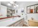 Bathroom with a large mirror, ample countertop space, and neutral tile flooring at 416 Western Rd, New Smyrna Beach, FL 32168