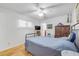 Bright bedroom offers neutral walls, light floors, and ceiling fan at 416 Western Rd, New Smyrna Beach, FL 32168