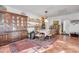 Formal dining room with classic hutch, a large wooden table, and tiled floors at 416 Western Rd, New Smyrna Beach, FL 32168