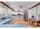 Bright kitchen with white cabinets, stainless steel appliances, and tile flooring at 416 Western Rd, New Smyrna Beach, FL 32168