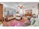 Comfortable living room with leather sofas, area rug, and wooden accents at 416 Western Rd, New Smyrna Beach, FL 32168