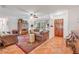 Cozy living room featuring tile floors, leather furniture, and a decorative rug at 416 Western Rd, New Smyrna Beach, FL 32168