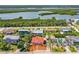 Aerial view of a charming neighborhood near the water, featuring well-maintained homes and lush landscaping at 4262 Cardinal Blvd, Port Orange, FL 32127