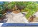Backyard with sand, bark and tropical foliage at 4262 Cardinal Blvd, Port Orange, FL 32127