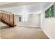 Finished basement with carpet, staircase, and a door leading to the exterior at 4262 Cardinal Blvd, Port Orange, FL 32127