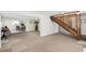 Spacious basement with staircase, neutral carpet, and views into an adjacent sitting room at 4262 Cardinal Blvd, Port Orange, FL 32127