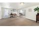 Well-lit basement area with seating area, tiled flooring, and outdoor access via a glass-paneled door at 4262 Cardinal Blvd, Port Orange, FL 32127