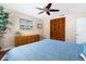 This charming bedroom boasts ample closet space, a dresser, and large window for natural light at 4262 Cardinal Blvd, Port Orange, FL 32127