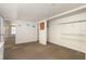 Large bonus room with tan carpet, wire rack shelving and white walls at 4262 Cardinal Blvd, Port Orange, FL 32127