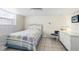 Relaxing bedroom with a window, wicker furniture, and tiled floors at 4262 Cardinal Blvd, Port Orange, FL 32127