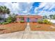 Charming single-story home with a well-maintained lawn, landscaping and mulch at 4262 Cardinal Blvd, Port Orange, FL 32127