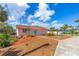 Charming single-story home featuring a well-maintained lawn and blue skies at 4262 Cardinal Blvd, Port Orange, FL 32127