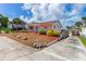 View of house with a long driveway and landscaping at 4262 Cardinal Blvd, Port Orange, FL 32127