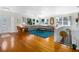 Spacious living room featuring hardwood floors, a large sectional sofa, and plenty of natural light at 4262 Cardinal Blvd, Port Orange, FL 32127