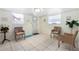 Bright living room featuring tile flooring, matching chairs, and lots of natural lighting at 4262 Cardinal Blvd, Port Orange, FL 32127