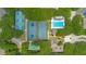 Enjoy recreation with tennis courts, shuffleboard, and a sparkling blue swimming pool amid a lush landscape at 4307 Sea Mist Dr # 135, New Smyrna Beach, FL 32169