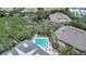 Aerial view of the community pool and surrounding landscaping at 4307 Sea Mist Dr # 135, New Smyrna Beach, FL 32169