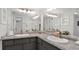 Bright bathroom features double sinks, granite counters, and modern fixtures at 4307 Sea Mist Dr # 135, New Smyrna Beach, FL 32169