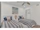 Tastefully decorated bedroom features a ceiling fan and cozy beds at 4307 Sea Mist Dr # 135, New Smyrna Beach, FL 32169