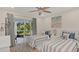 Comfortable bedroom with a sliding glass door and stylish furnishings at 4307 Sea Mist Dr # 135, New Smyrna Beach, FL 32169