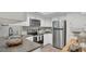Modern kitchen equipped with stainless steel appliances and white cabinetry at 4307 Sea Mist Dr # 135, New Smyrna Beach, FL 32169