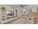 Bright living room with neutral tones, large TV, and comfortable seating arrangement at 4307 Sea Mist Dr # 135, New Smyrna Beach, FL 32169