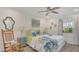 Comfortable main bedroom with ceiling fan, rocking chair and colorful decor at 4307 Sea Mist Dr # 135, New Smyrna Beach, FL 32169